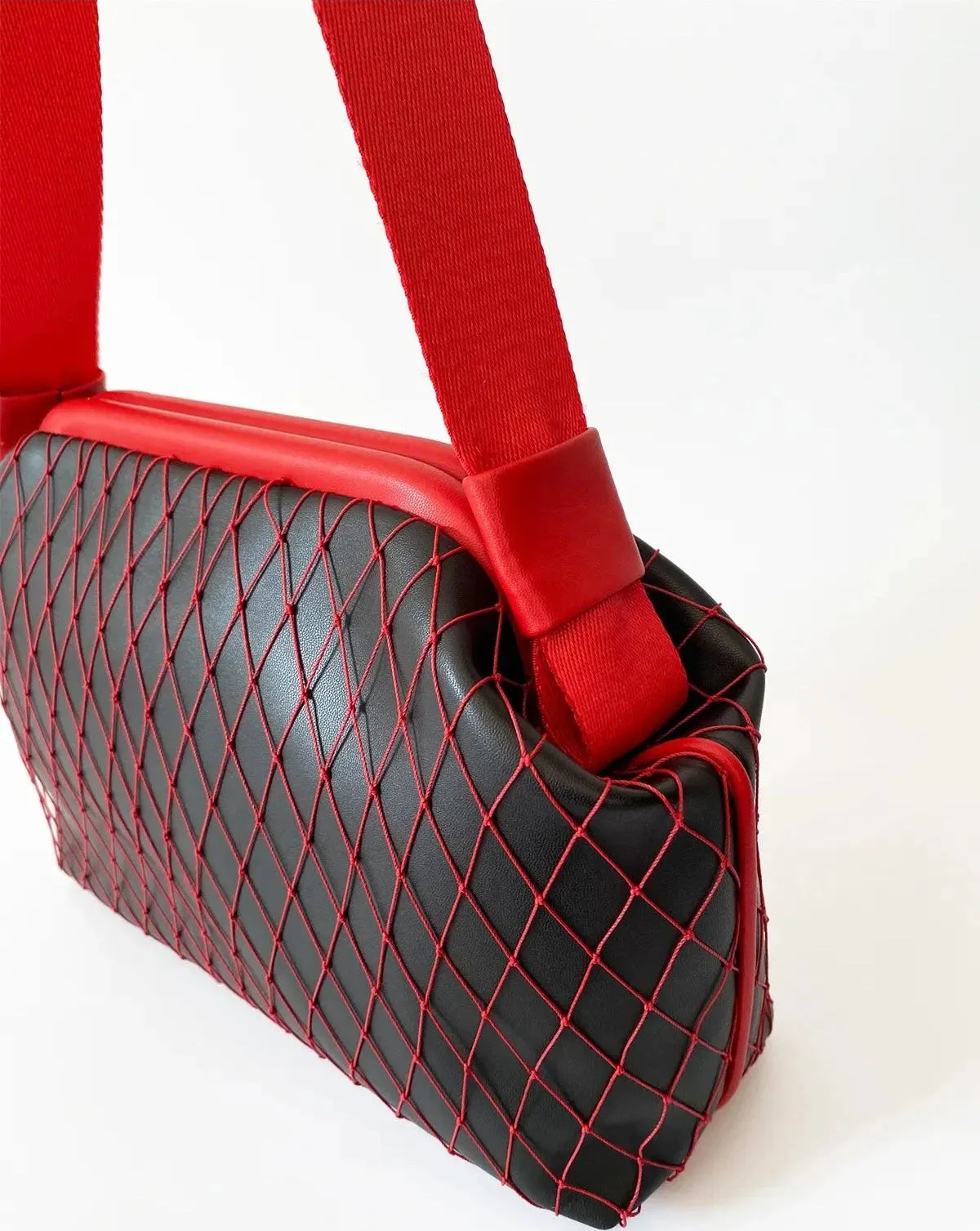 Stylish Black Faux Leather Handbag with Red Mesh Detailing